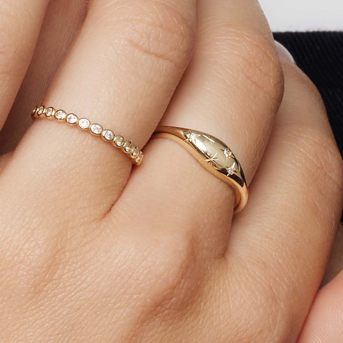 Golden ring in the shape of a diamond