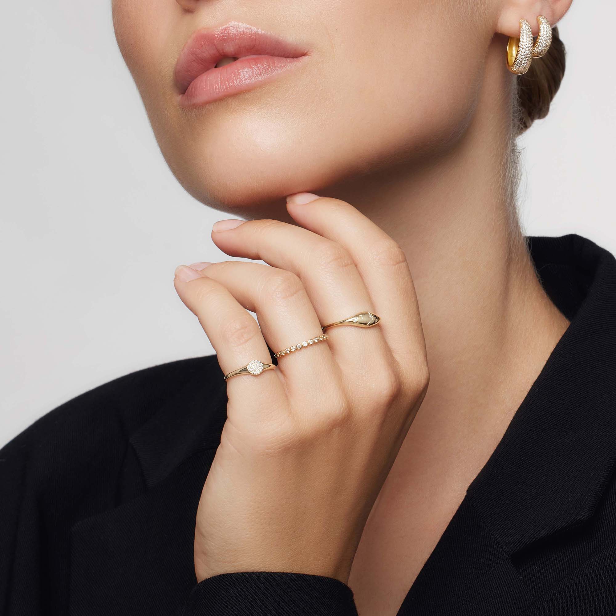 Golden ring in the shape of a diamond