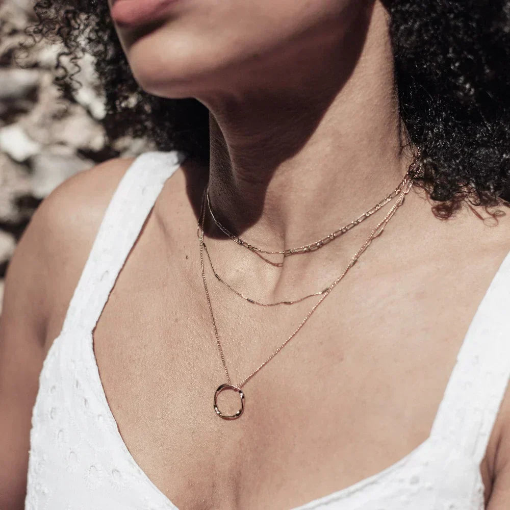 Three-row gold open round necklace